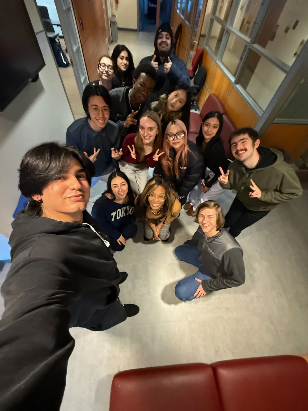 Professor Zuleika Cuevas with a cohort of students after a session.