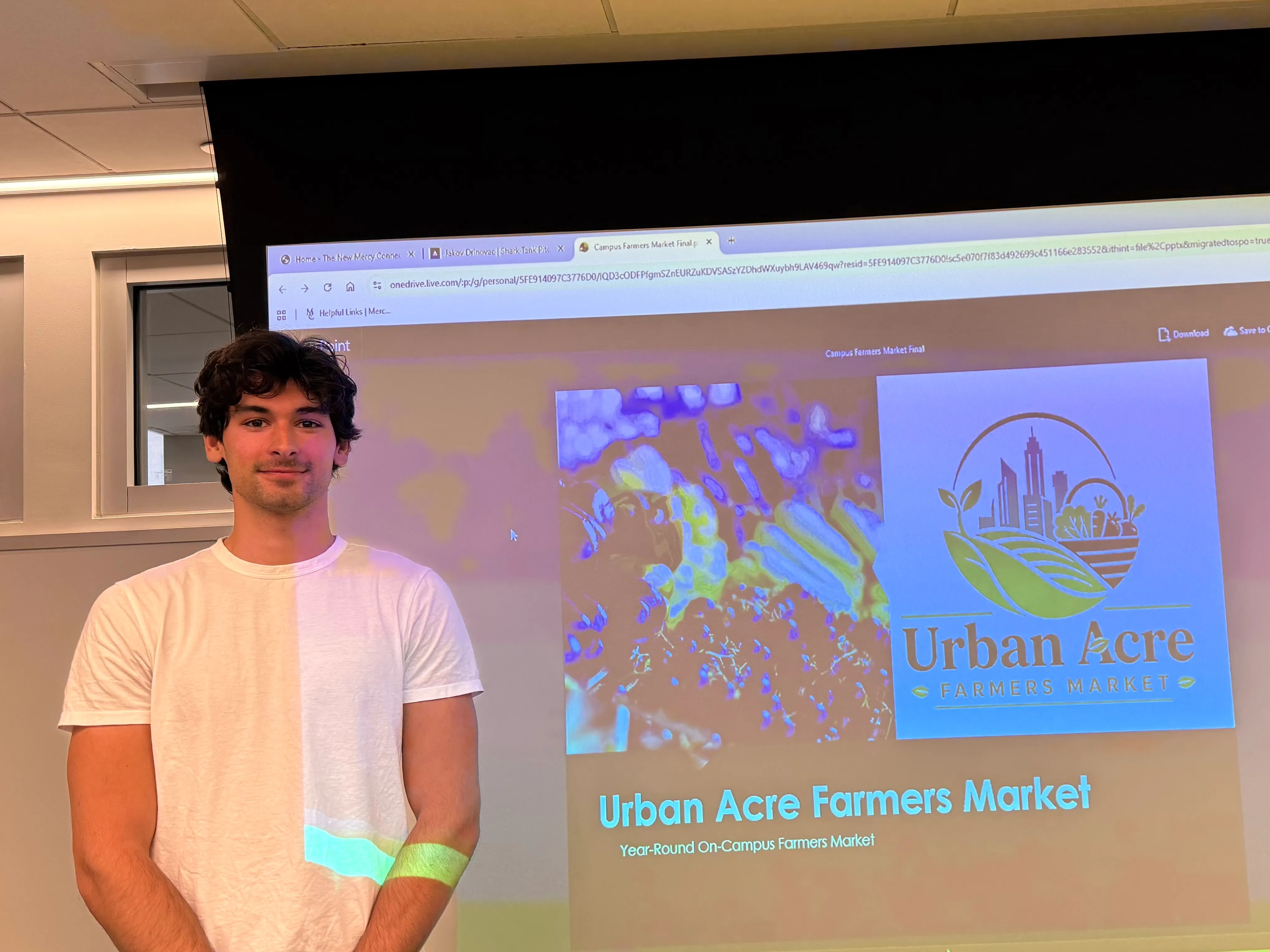 Jakov Drinovac presenting Urban Acre Farmers Market at the Career Shark Tank finale.